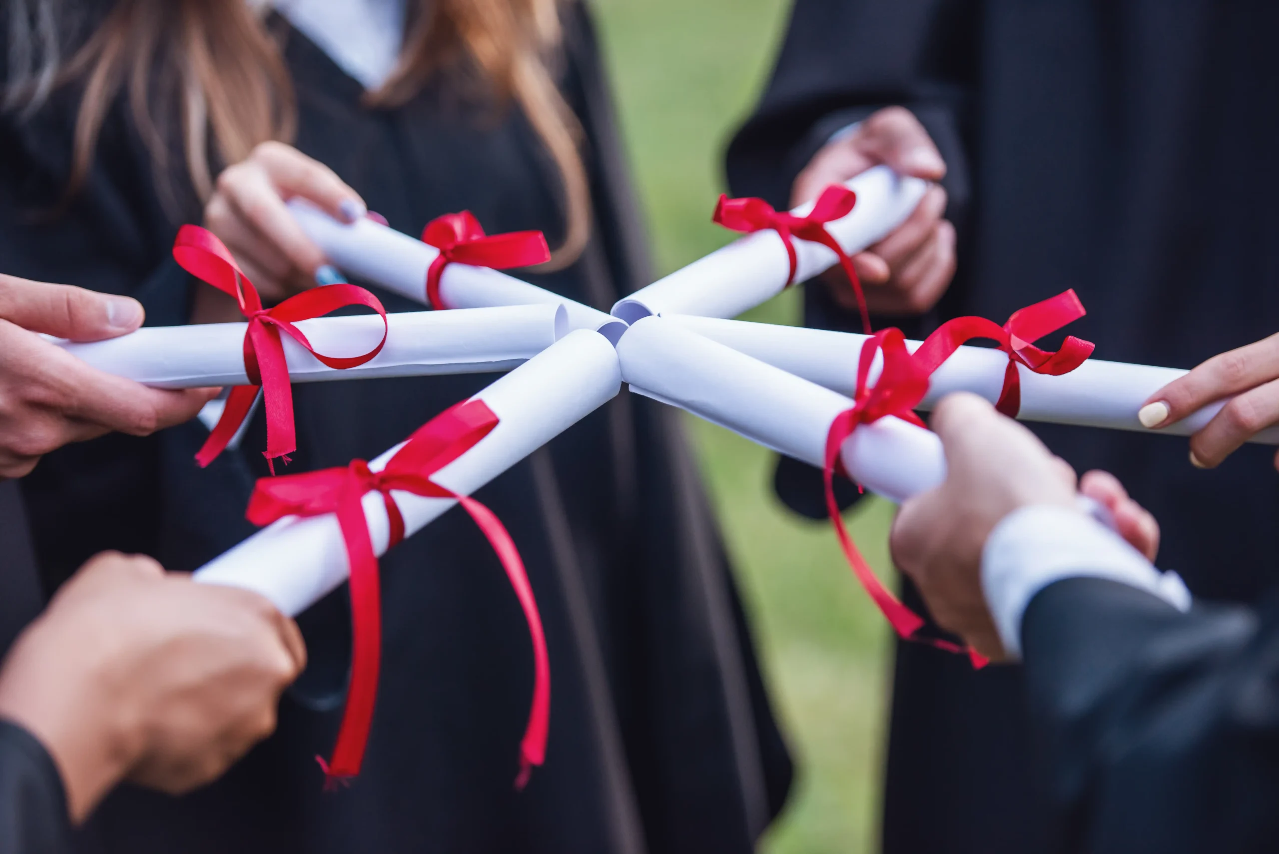 group celebrates graduation holding diplomas with 2026 01 05 22 57 38 utc